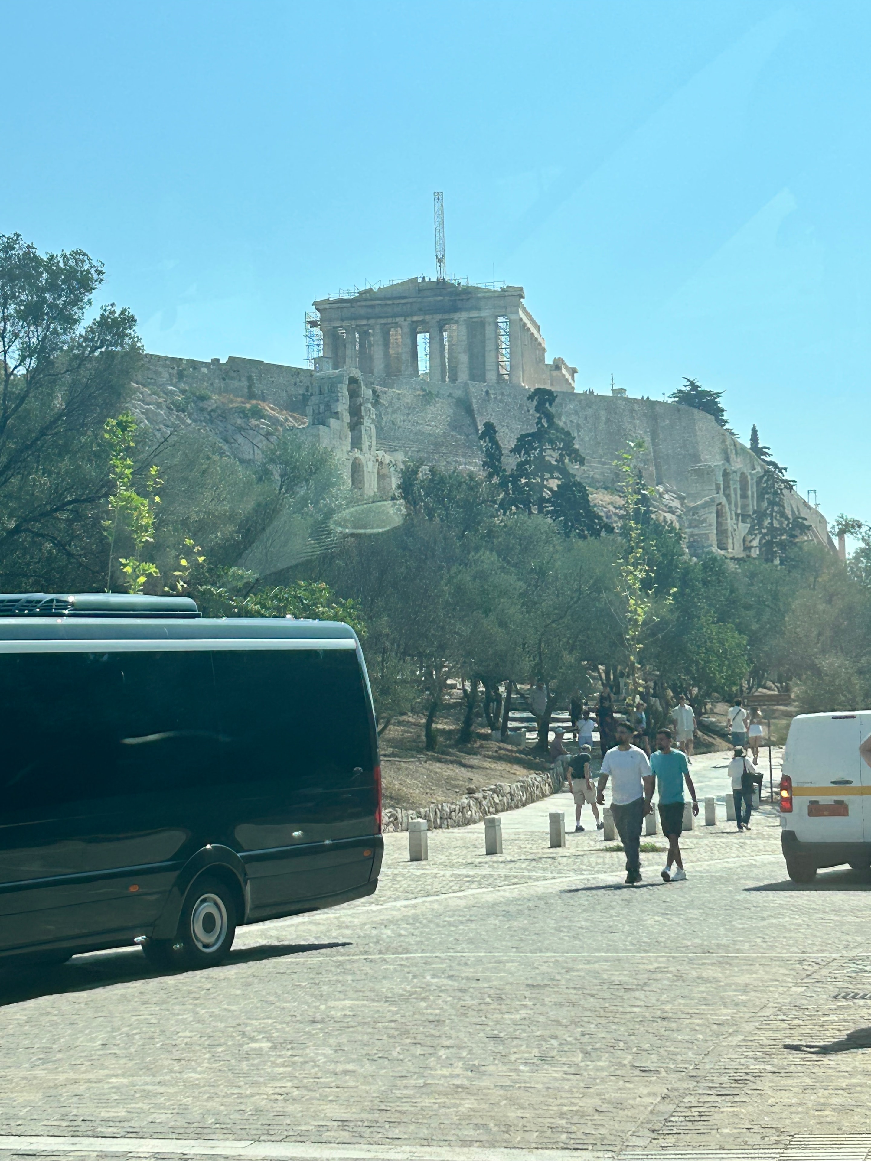 Panoramic Athens cityscape view through pine trees from the Acropolis hill